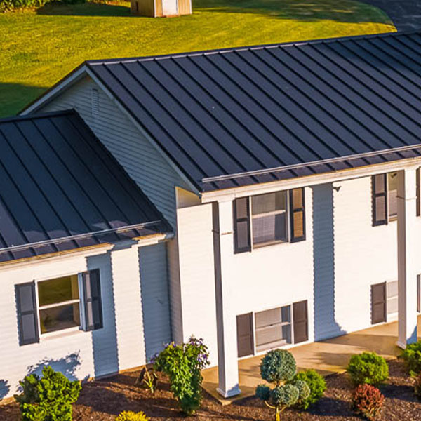 Close-up of a home with new ABSeam black metal panels by AB Martin